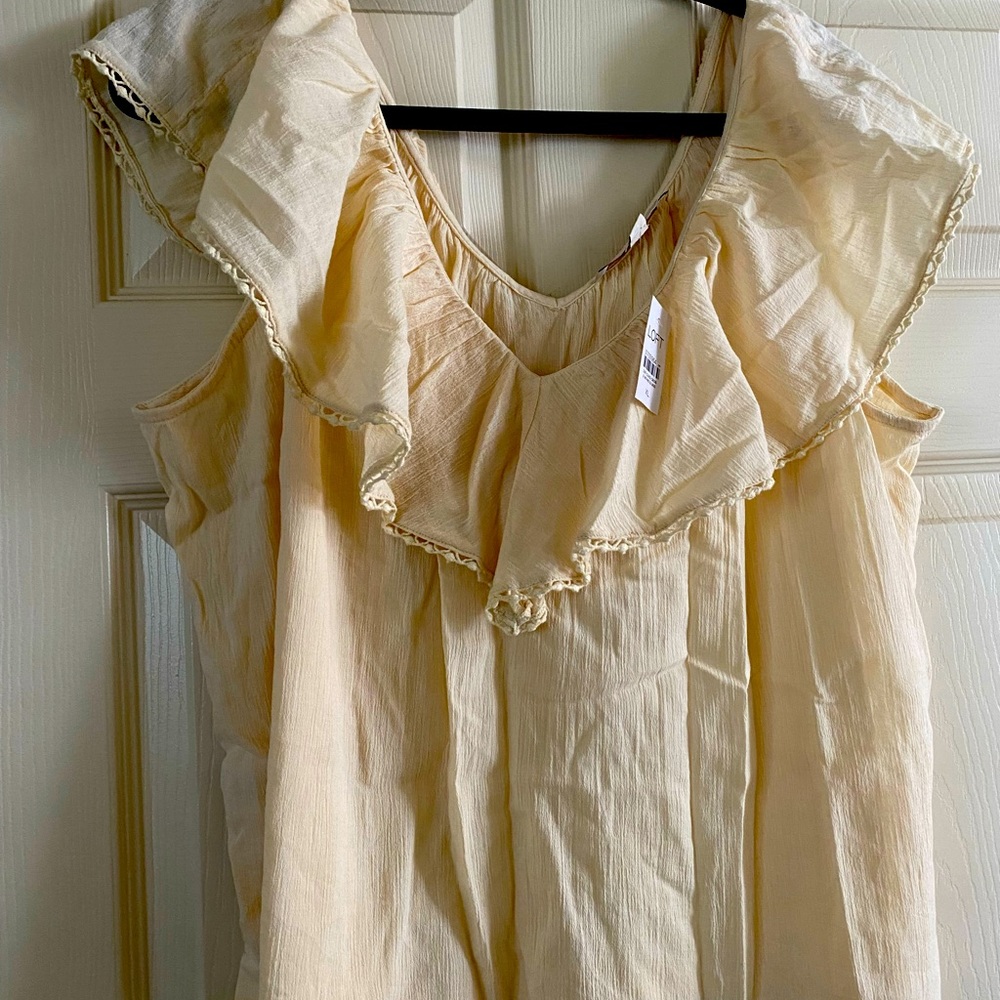 LOFT Ruffle sleeveless cream colored top.